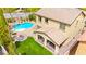 Aerial view of a backyard featuring a pool, spa, fire pit, and covered patio at 419 Vigo Port St, Las Vegas, NV 89138
