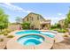 Beautiful backyard with a pool, spa, covered patio and well-maintained landscaping at 419 Vigo Port St, Las Vegas, NV 89138