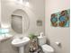 Charming bathroom with pedestal sink, toilet, and decorative accents at 419 Vigo Port St, Las Vegas, NV 89138