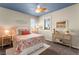 Bright bedroom with orange accents, a ceiling fan, and a comfortable bed at 419 Vigo Port St, Las Vegas, NV 89138