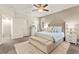 Comfortable bedroom featuring a tufted headboard bed and neutral decor at 419 Vigo Port St, Las Vegas, NV 89138