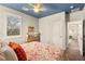 Cozy bedroom with orange accents, a ceiling fan, and a view of the backyard at 419 Vigo Port St, Las Vegas, NV 89138