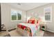 Bright bedroom featuring an accent wall, white shutters, and a comfortable bed at 419 Vigo Port St, Las Vegas, NV 89138