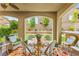 Inviting covered patio featuring outdoor seating, arched entryways, and a colorful rug at 419 Vigo Port St, Las Vegas, NV 89138