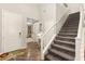 Welcoming entryway features wood-look floors, staircase, and neutral walls and doors at 419 Vigo Port St, Las Vegas, NV 89138