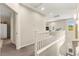 Bright hallway with carpet flooring, white railings, and natural light at 419 Vigo Port St, Las Vegas, NV 89138