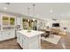 Bright and airy kitchen with a large island, white cabinets, stainless steel appliances, and seamless flow to the living area at 419 Vigo Port St, Las Vegas, NV 89138