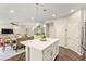 Modern kitchen island with seating and pendant lights, open to the dining and living areas at 419 Vigo Port St, Las Vegas, NV 89138