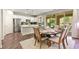 Modern kitchen with stainless steel appliances, quartz counters, white cabinets adjacent to the dining area at 419 Vigo Port St, Las Vegas, NV 89138
