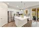 Well-lit kitchen featuring stainless steel appliances, white cabinetry, and a seamless connection to the outdoor space at 419 Vigo Port St, Las Vegas, NV 89138