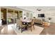 A dining room and living room area features a view of an enclosed patio and seating area at 419 Vigo Port St, Las Vegas, NV 89138