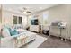 Stylish living room featuring a ceiling fan, recessed lighting, and a comfortable white sofa at 419 Vigo Port St, Las Vegas, NV 89138