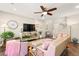 Comfortable living room featuring a ceiling fan, large screen TV, and cozy seating at 419 Vigo Port St, Las Vegas, NV 89138