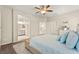 Bright main bedroom with ceiling fan, ensuite bathroom access and neutral color scheme at 419 Vigo Port St, Las Vegas, NV 89138
