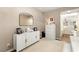 Bright home office featuring a white cabinet, modern mirror, and neutral decor at 419 Vigo Port St, Las Vegas, NV 89138