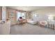 Bright bedroom with large window, desk area, and comfortable seating at 4433 Bayley Skye Ave # 104, Las Vegas, NV 89141