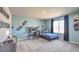 Bright bedroom featuring a desk, large window, and modern decor at 4433 Bayley Skye Ave # 104, Las Vegas, NV 89141