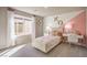 Charming bedroom with stylish decor, plush carpet, and a large window at 4433 Bayley Skye Ave # 104, Las Vegas, NV 89141