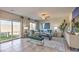 Bright living room with neutral tones, access to backyard, and modern decor at 4433 Bayley Skye Ave # 104, Las Vegas, NV 89141