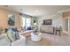 Cozy living room boasts modern furnishings, plush carpet, and ample natural light at 4433 Bayley Skye Ave # 104, Las Vegas, NV 89141