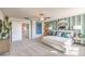 Spacious main bedroom with ensuite, ceiling fan, and a feature wall at 4433 Bayley Skye Ave # 104, Las Vegas, NV 89141