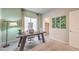 Well-lit home office with large window, modern desk, and comfortable seating at 4433 Bayley Skye Ave # 104, Las Vegas, NV 89141