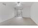 Unfurnished bedroom featuring carpeted floors and sliding doors leading to a balcony at 4555 E Sahara Ave # 280, Las Vegas, NV 89104