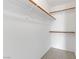Walk-in closet featuring multiple shelves and wooden rods for organized storage at 4555 E Sahara Ave # 280, Las Vegas, NV 89104