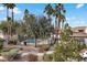 Community pool area with palm trees and well-maintained landscaping at 4555 E Sahara Ave # 280, Las Vegas, NV 89104