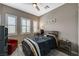 Cozy bedroom features plantation shutters, a ceiling fan, and a modern design at 468 Harvest Rain, Las Vegas, NV 89011