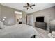 This bedroom features a gray theme and an adjoining bathroom, with wood flooring and bright, neutral paint at 468 Harvest Rain, Las Vegas, NV 89011