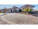 Upscale clubhouse entrance showcasing a circular driveway and manicured landscaping at 468 Harvest Rain, Las Vegas, NV 89011