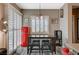 Cozy dining area featuring a retro refrigerator, natural light, and stylish decor at 468 Harvest Rain, Las Vegas, NV 89011