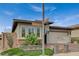 Charming home featuring desert landscaping, brick accents, and a two-car garage on a sunny day at 468 Harvest Rain, Las Vegas, NV 89011