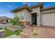 Beautiful home with a brick driveway, desert landscaping, and a well-maintained front yard at 468 Harvest Rain, Las Vegas, NV 89011