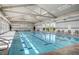 Bright indoor pool featuring lane markers, ample seating, and floor-to-ceiling windows at 468 Harvest Rain, Las Vegas, NV 89011