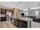 Spacious open-concept kitchen with a large island, stainless steel appliances, and seamless flow to the living area at 468 Harvest Rain, Las Vegas, NV 89011