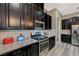 Gourmet kitchen with stainless steel appliances, dark cabinets, and ample counter space at 468 Harvest Rain, Las Vegas, NV 89011