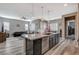 Expansive kitchen island, stainless steel appliances, and open-concept living space at 468 Harvest Rain, Las Vegas, NV 89011