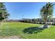 Lush community park with a grassy area, walking paths, and comfortable seating under a clear sky at 468 Harvest Rain, Las Vegas, NV 89011