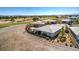 Aerial view featuring desert landscaping, golf course and pond, and mountain views at 4924 E Cactus Canyon Dr, Pahrump, NV 89061