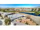 An aerial view of the property's backyard with pond views and desert landscaping at 4924 E Cactus Canyon Dr, Pahrump, NV 89061