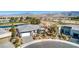 Stunning aerial view showcasing the home, its manicured landscaping, nearby golf course, and the surrounding desert landscape at 4924 E Cactus Canyon Dr, Pahrump, NV 89061