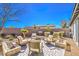 Cozy backyard seating area with a fire pit and desert landscaping, perfect for entertaining at 4924 E Cactus Canyon Dr, Pahrump, NV 89061