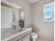 Modern half bath with a sleek vanity, contemporary fixtures, and natural light at 4924 E Cactus Canyon Dr, Pahrump, NV 89061