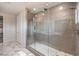 Modern bathroom featuring a large walk-in shower with glass enclosure and decorative tile at 4924 E Cactus Canyon Dr, Pahrump, NV 89061