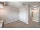 Neutral bedroom with closet, ensuite bathroom, and contemporary hanging light fixture at 4924 E Cactus Canyon Dr, Pahrump, NV 89061