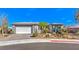 Charming single-story home featuring desert landscaping, a two-car garage, and a paved driveway at 4924 E Cactus Canyon Dr, Pahrump, NV 89061