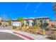 Attractive home with desert landscaping, a paved driveway, and a well-maintained exterior, offering curb appeal at 4924 E Cactus Canyon Dr, Pahrump, NV 89061