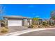 Well maintained home with a desert-themed front yard, a paved driveway, and a two-car garage, offering great curb appeal at 4924 E Cactus Canyon Dr, Pahrump, NV 89061